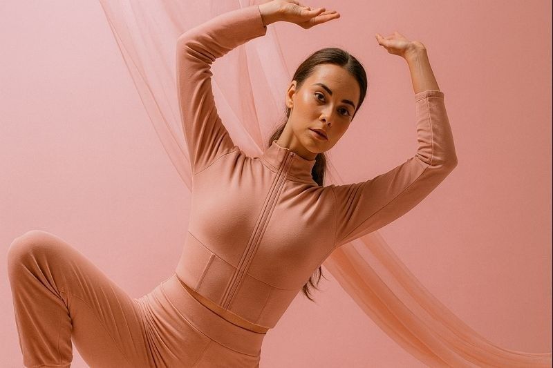 Woman stretching in a private fitness studio, demonstrating a calm and focused workout environment