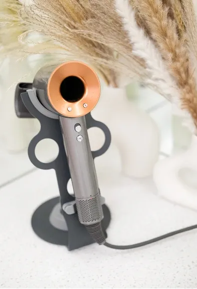 Hair dryer placed on a stand in the studio beauty corner