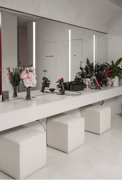 Vanity area with mirrors and beauty tools inside the BODIFY studio