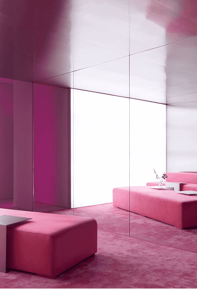 Pink lounge area with mirrored walls inside a women-only fitness studio in Downtown Dubai