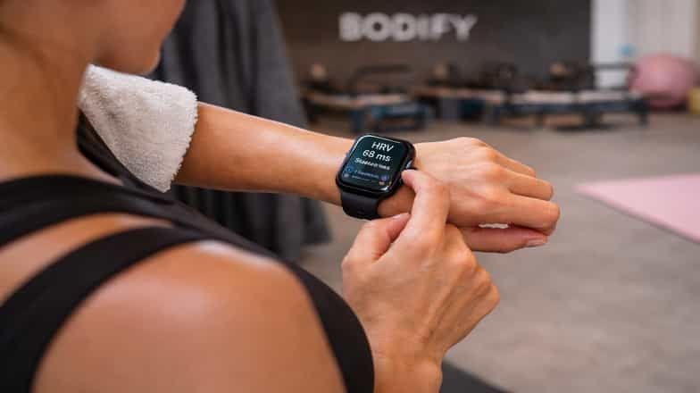 Woman checking her HRV on a smartwatch at BODIFY