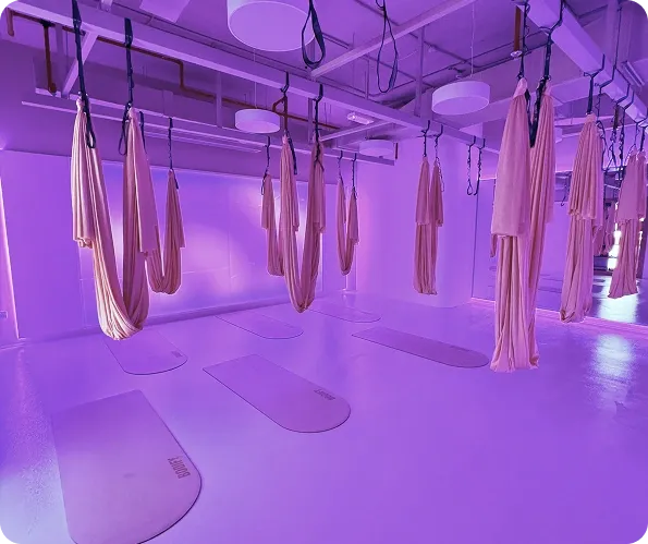 Aerial yoga hammocks in a women’s gym studio in Dubai